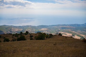 View on a green valley with mountain background