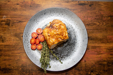 A delicious mean roast stuffed with stuffing on a wooden background