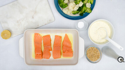 Salmon fillet on baking dish, flat lay. Baked salmon, and vegetable casserole recipe