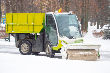 machine for cleaning snow on a city street cleans the road