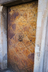Ancient metal door in an abandoned castle