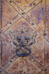 Ancient metal door in an abandoned castle
