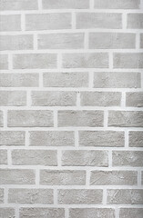 Fototapeta premium Grey brick wall imitation texture. White and beige plaster background.