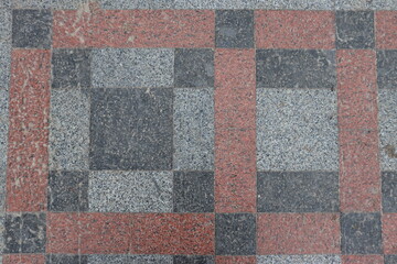 The texture of the pavement lined with granite tiles.