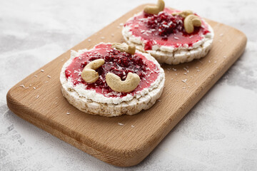 Rice Cakes with Cream Cheese and Raspberry Jam with Cashew Nuts