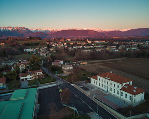 View from above between hills and snow-capped mountains