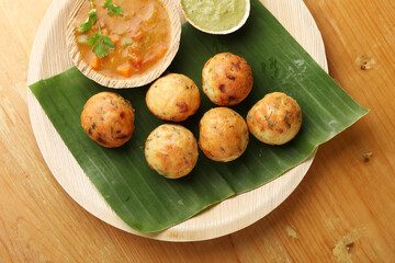 Kuzhi Paniyaram served with coconut chutney and sambar- South Indian breakfast
