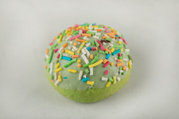 Colorful sweet small doughnut with sprinkles