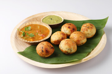 Kuzhi Paniyaram served with coconut chutney and sambar- South Indian breakfast