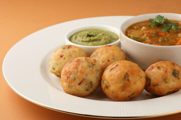 Kuzhi Paniyaram served with coconut chutney and sambar- South Indian breakfast