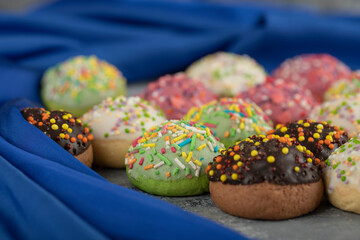 Colorful sweet small doughnuts with sprinkles