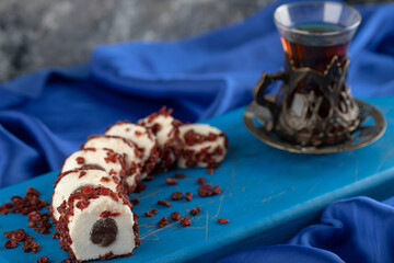 Sliced sweet dessert with a cup of tea