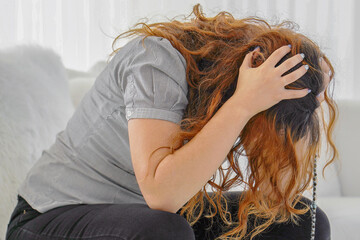 Close up portrait of a sad ill woman. Woman worried about the future. Portrait of a sad woman