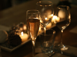 Wine and champagne glasses on festive Christmas dinner table 