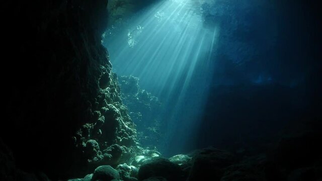 sun rays sun beams and sun shine underwater in cave beautiful light scenery in ocean scuba divers to see