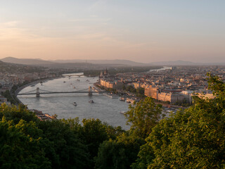 view of chain bridge and danube river at sunset from citadella in budapest