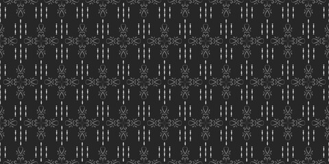 Floral ornament in gray tones on a black background. Monochrome pattern. Seamless wallpaper texture