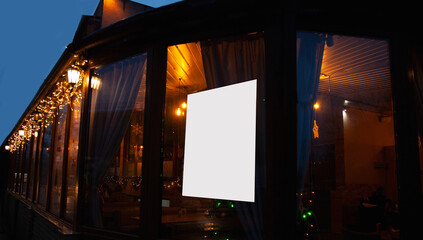 Obraz premium empty wooden table on blurred light gold bokeh of cafe restaurant on dark background, blurred cafe interior place for your products on the table