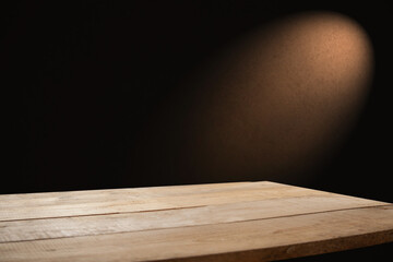 empty wooden table for groceries on dark background