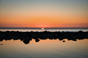 Sunrise at the beach and the rowers training in Spain © ruthlaguna