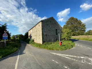 Fototapeta na wymiar Old stone barn, by the B6478 road near, Long Preston, Skipton, UK