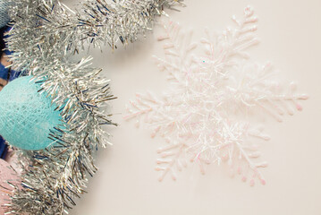 Garland of balloons and silver tinsel next to a snowflake