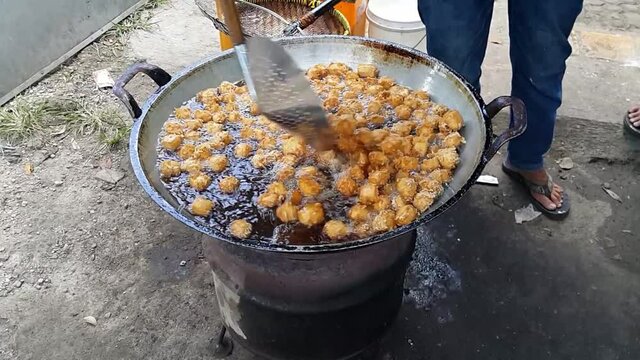 Deep frying tofu on the street.