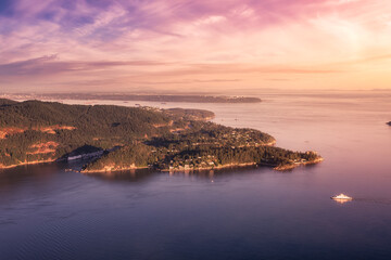 Horseshoe Bay, West Vancouver, British Columbia, Canada. Aerial view of Ferry Terminal and Marina. Sunny and colorful Sunset Sky Art Render.