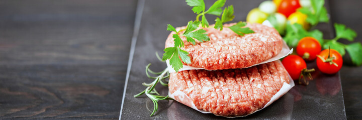 Burger cutlets. Uncooked mincemeat. Banner