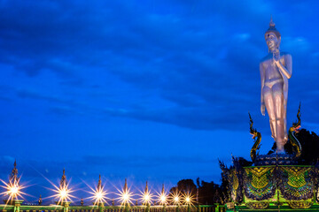 Background of Thailand's Chonburi religious attractions (Wat Khao Phra Khru viewpoint), with beautiful Buddha and Phaya Naga statues, tourists always come to make merit and take pictures at night.
