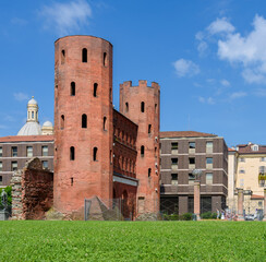 Ruins and modern
The old red ruins and the modern grey palaces in Porta Palatina in Turin (Italy)