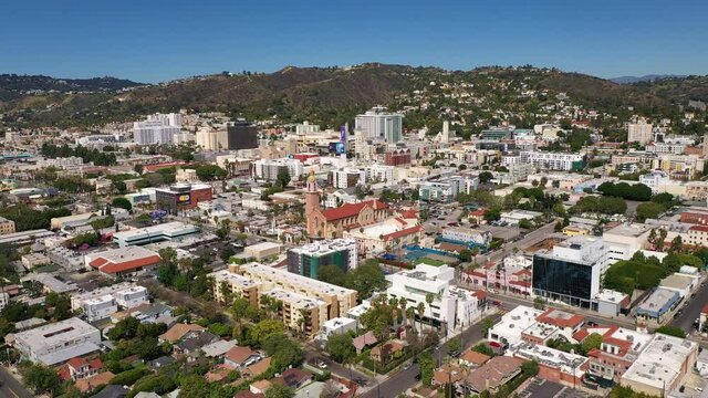 Low aerial and tilting up shot of downtown Hollywood. 4K