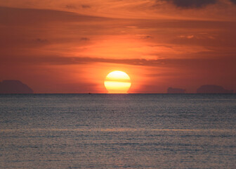 Scene of beautiful omega sunrise at Saphanhin , Phuket