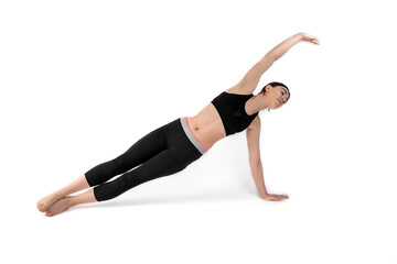 Fototapeta premium Young woman doing yoga practice isolated on white background. Flexible fit female body. Horizontal shot. High resolution sharp photo.