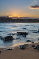 Sunset, rocks and the sea