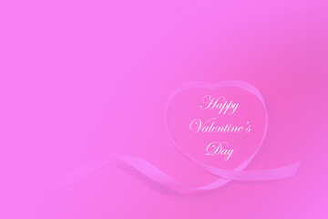 Pink heart shape ribbon on pink  background with copy space . Love celebration postcard concept - 14th Valentine's Day 