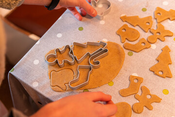 A process of cooking Christmas gingerbread biscuits of a different shape in oven