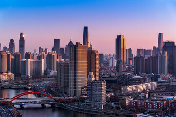 Sunset waterfront downtown skyline with Tianjin high-rise building cityscape at Haihe riverside, , Tianjin city, China