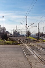 Fototapeta na wymiar View of the railway tracks along Pervomayskaya street from the intersection of Radivoja Koraca street in the city of Pancevo, Serbia