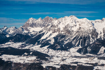 Fototapeta premium Scheichenspitze Mountain Peak in the Dachstein Mountain Range and the Village of Ramsau am Dachstein from Above in Winter