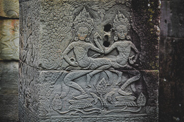 Bas-relief decoration depicting the Apsara Dancers in the walls of Angkor Wat in Cambodia
