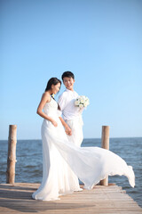 Couple in Wedding Dress on beach