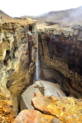 Dangerous waterfall in autumn in Kamchatka