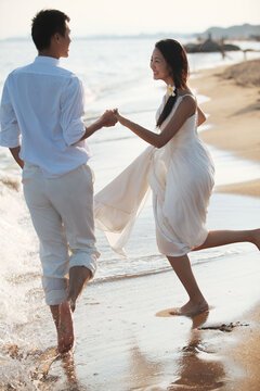 Couple in Wedding Dress on beach