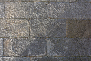 stone wall with square granite blocks
