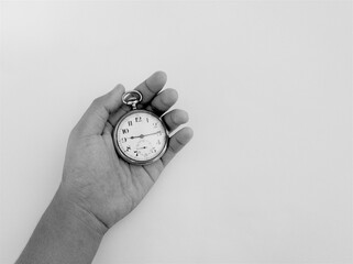 hand holding a stopwatch