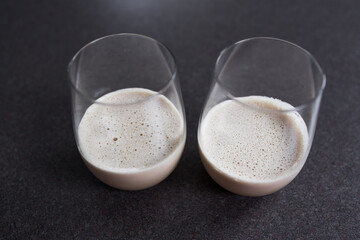 couple of espresso martinis in wine glasses