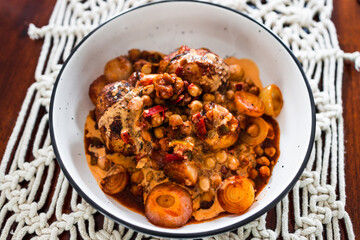 plant-based food, vegan potato and onion roast with chickpeas tomato sauce and herbs