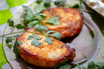 Baked steaks with crust and herbs