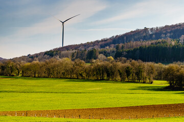 Countryside landscape with wind turbine, France